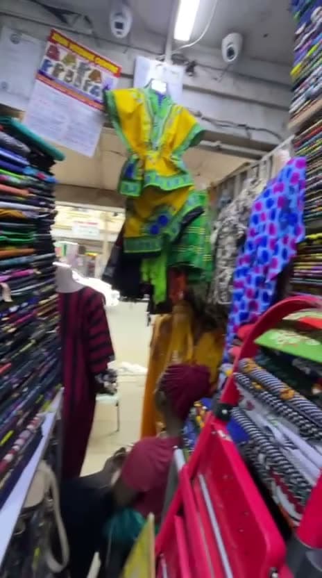 Inside and outside the Zion Vitenge Centre shop in JMart Building, River Road